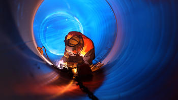 worker in a large tube